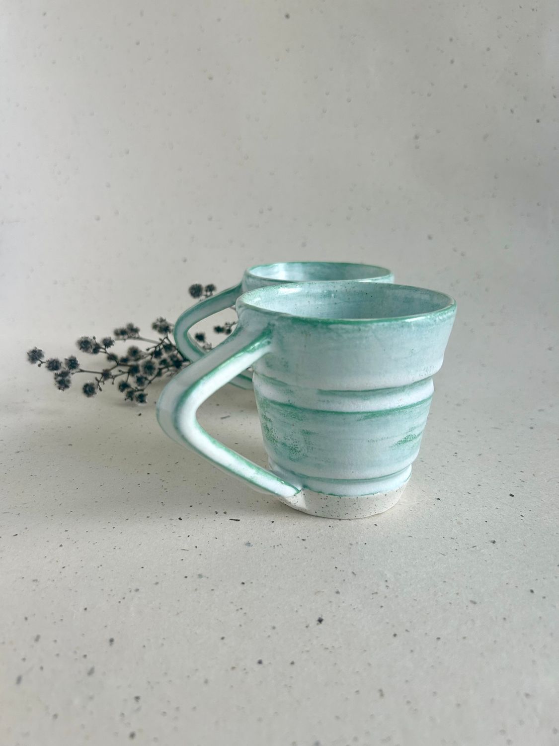 Green mug with angled handle