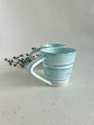 Green mug with angled handle
