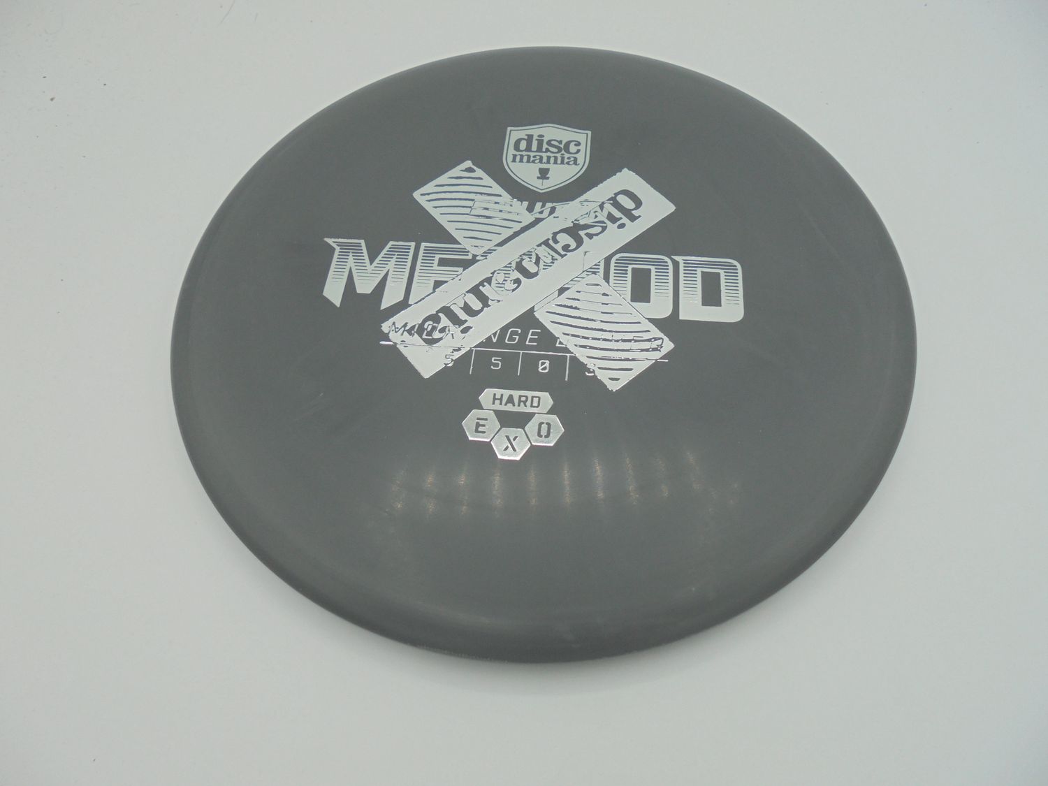 Discmania Exo Hard Method X-Out Stamp Black 177g -LM