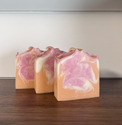 Bars of soap with pink, orange and white swirl