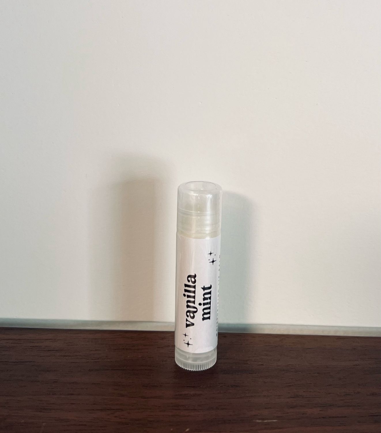Tube of lip balm with white label