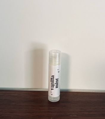 Tube of lip balm with white label