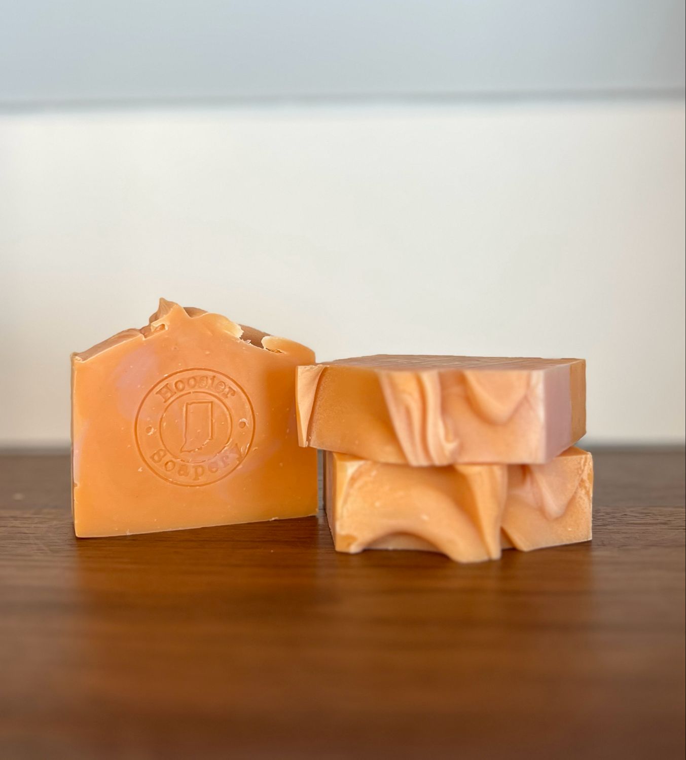 3 soap bars with light pink and orange swirl