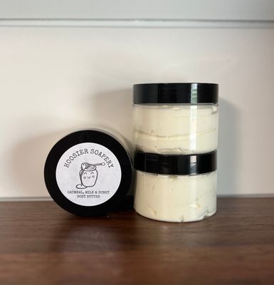 Plastic Jars of White lotion with black Lid