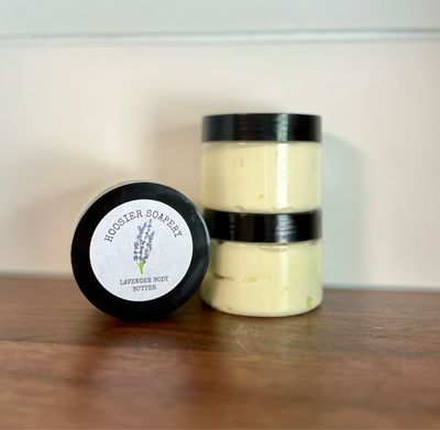 3 clear plastic jars with white lotion and black lid