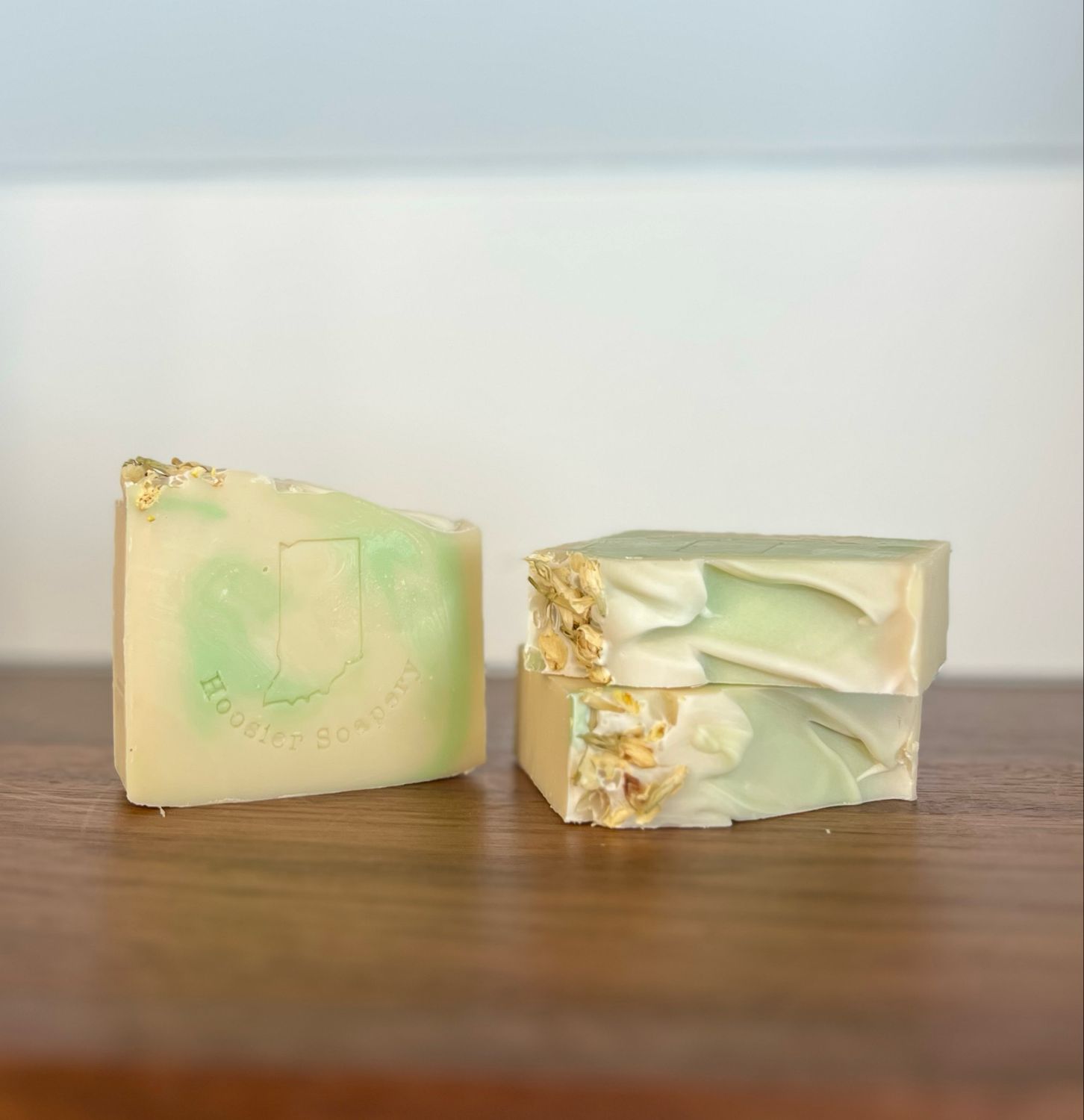 3 yellow soap bars with a light green swirl