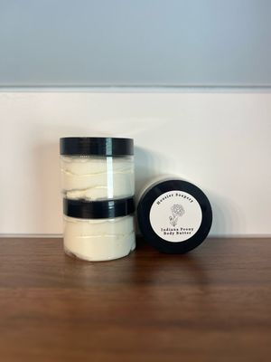 3 clear jars of body butter with black lid