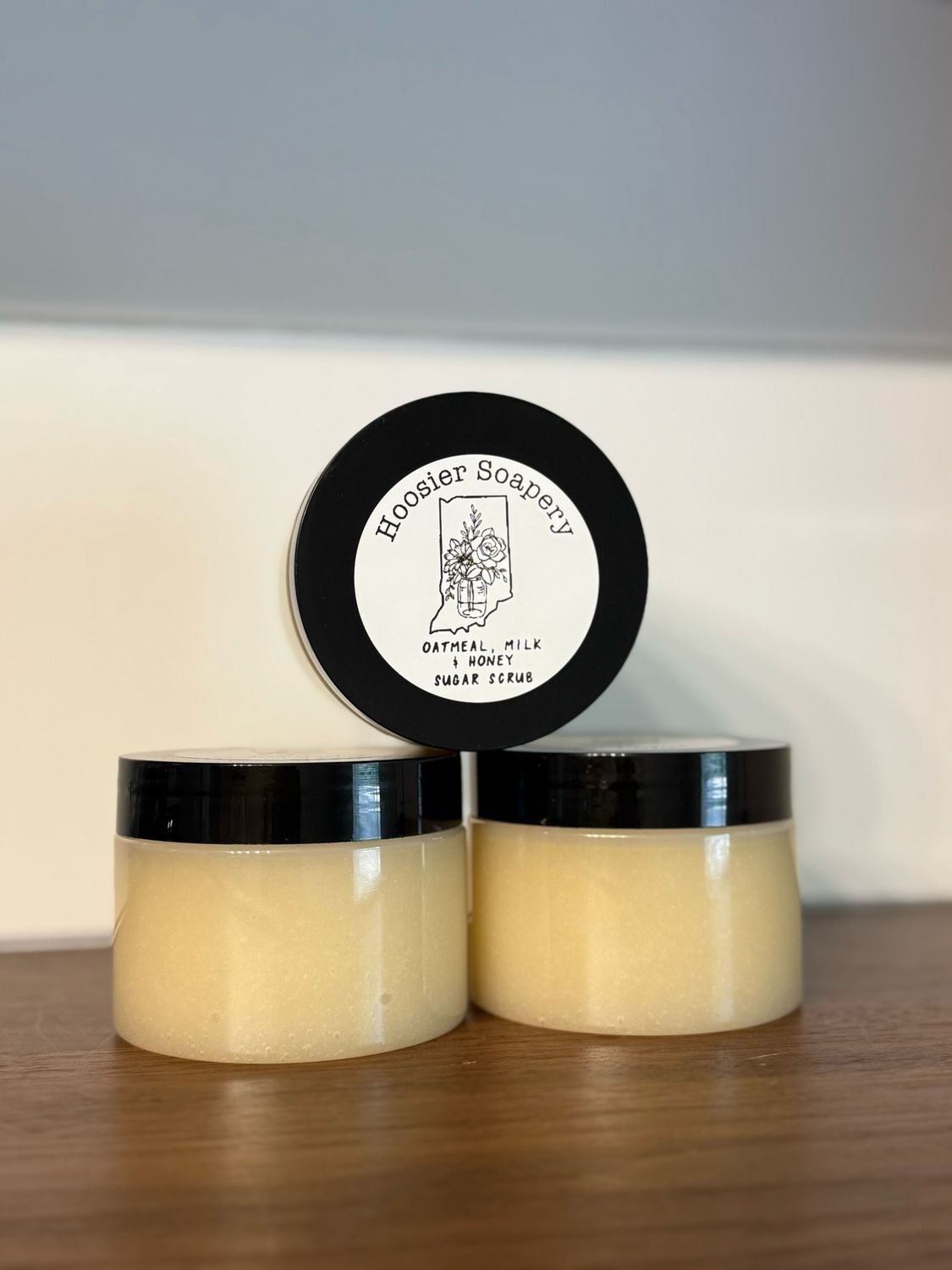 3 jars of tan sugar scrub with black lid