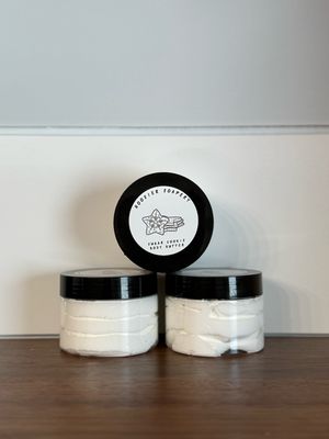 3 clear jars with white lotion and black lid