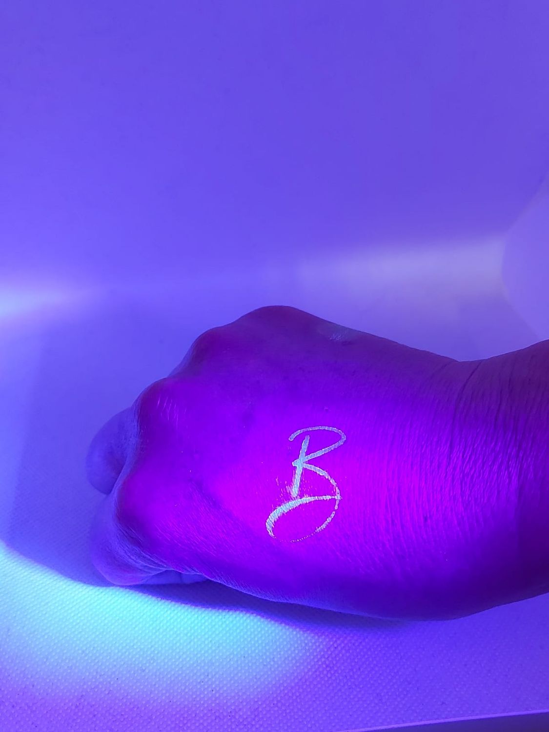 Hand with a uv stamp on it 