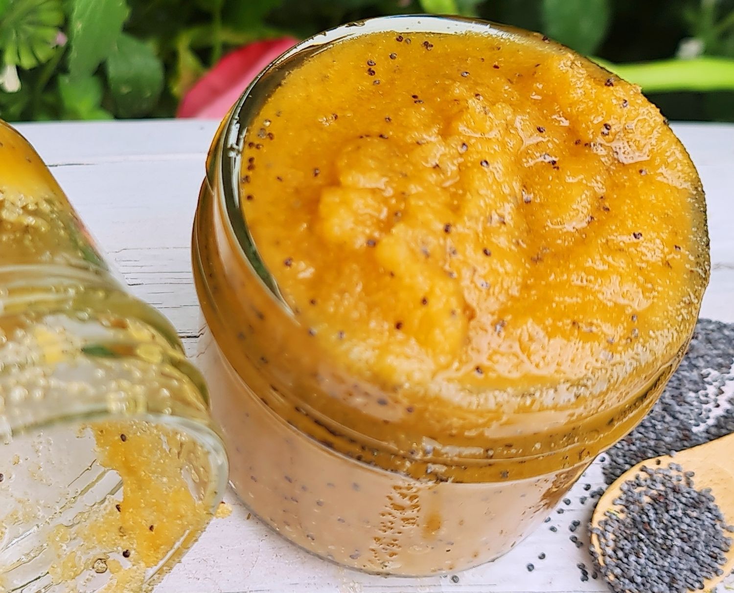 Handcrafted Lemon &amp; Poppy Seed Sugar Scrub in a glass jar, showcasing its vibrant yellow color with visible poppy seeds for natural exfoliation. Made with organic ingredients like coconut oil, sweet almond oil, and lemon essential oil, this vegan, cruelty-free scrub is perfect for gentle exfoliation and deep moisturization.