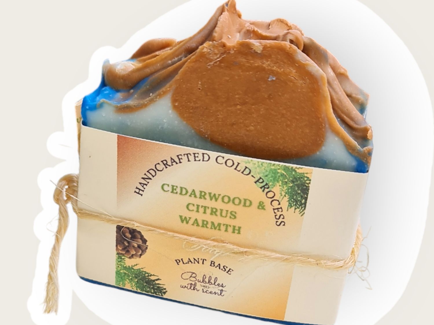 Handcrafted Cedarwood &amp; Citrus Warmth Soap with a blue and brown swirl design, wrapped in eco-friendly packaging, plant-based and cold-process soap