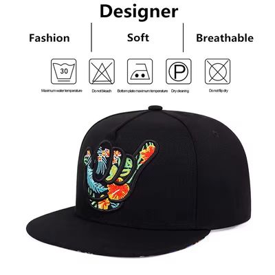 Colorful handcrafted floral patch on a trendy black hip-hop snapback baseball cap size fits all.