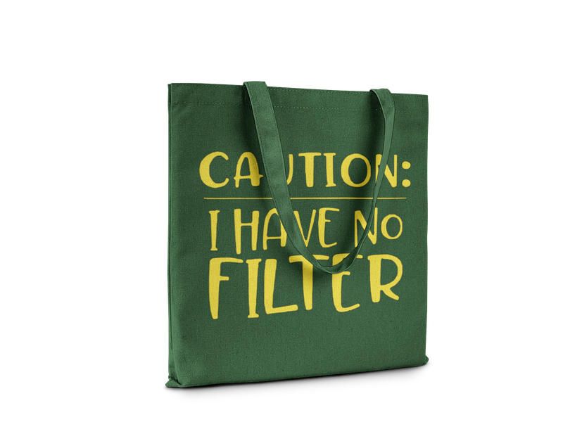 Green canvas tote bag with large yellow text "Caution: I Have No Filter