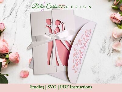 Finished wedding card in pink and white paper made with a 3D SVG template for a wedding card featuring a Bride and Groom on different sides of the card that come together in an embrace when the card is closed.