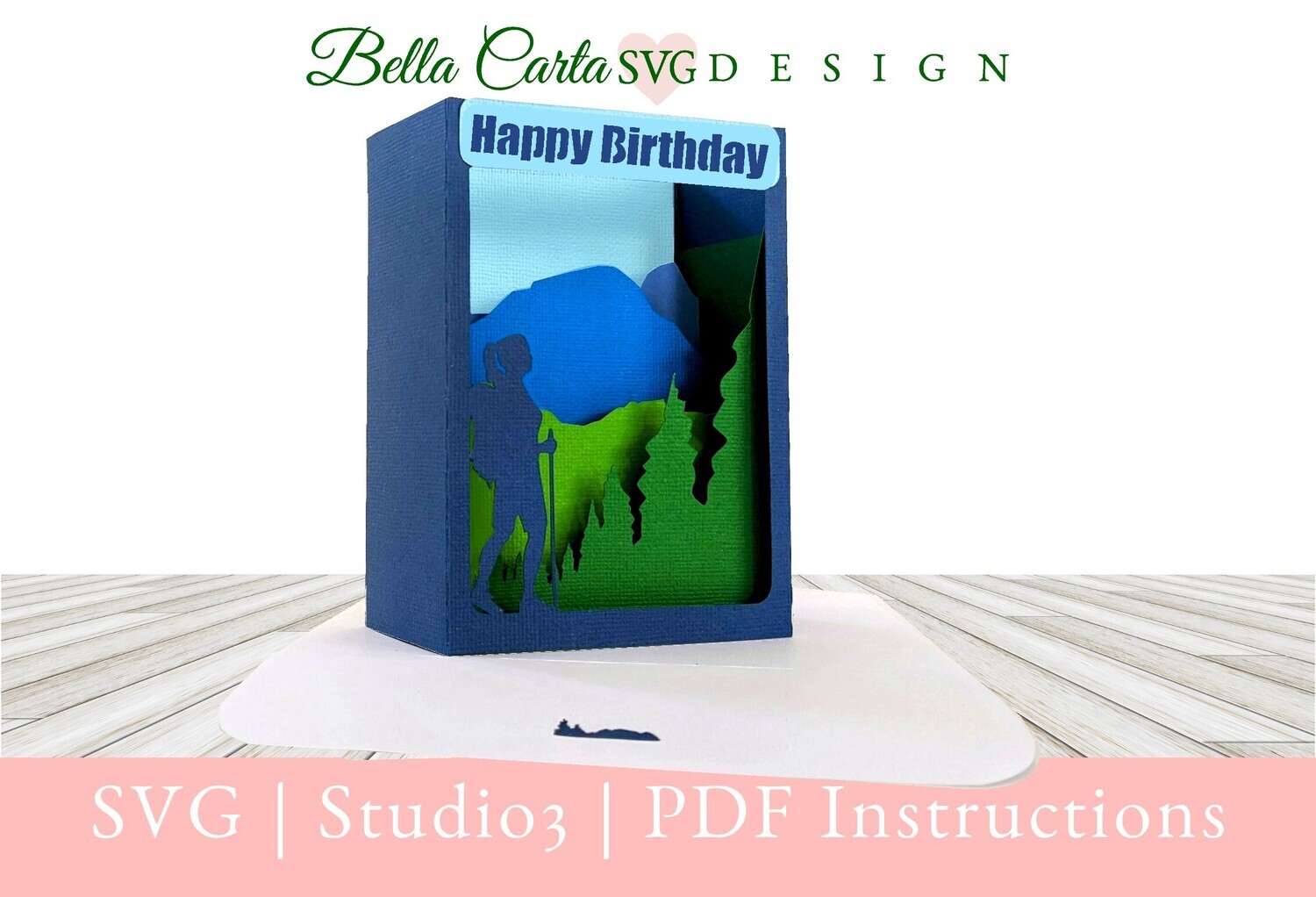 Pop-up shadowbox Greeting card made with a Cricut depicting a hiker in the mountains. Contains versions for either a woman or man hiker.