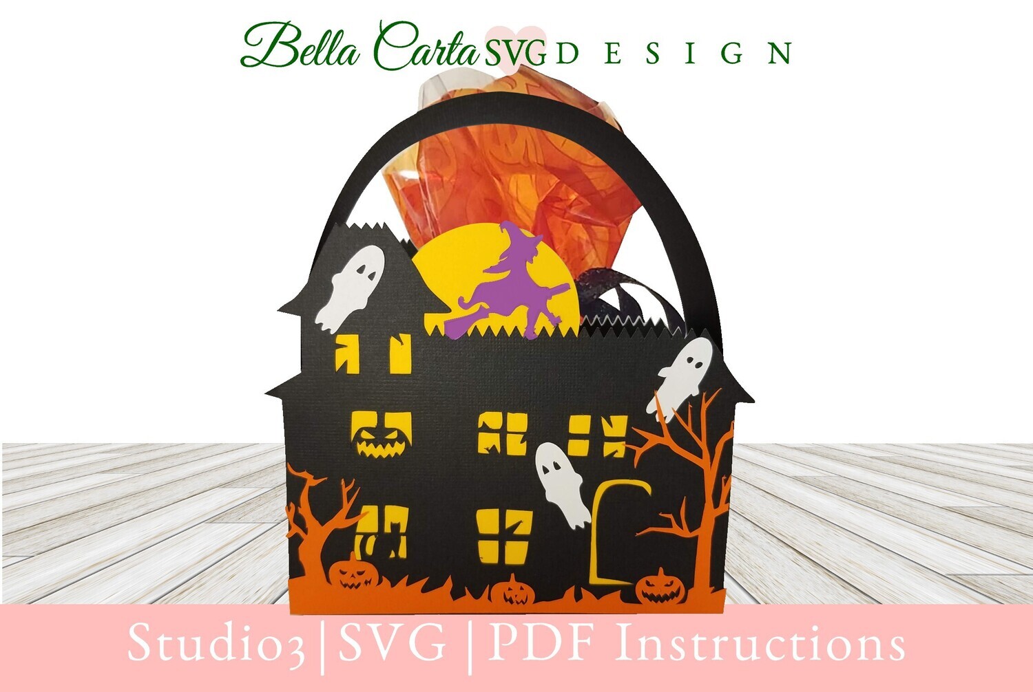 Halloween House basket crafted with a Cricut and an SVG template featuring a haunted house surrounded by playful ghosts , jack-o’lantern pumpkins, spooky trees, and a witch flying across the full moon.