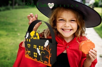 Little girl holding the Halloween House basket crafted with a Cricut and an SVG template featuring a haunted house surrounded by playful ghosts , jack-o’lantern pumpkins, spooky trees, and a witch flying across the full moon.