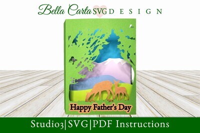 Create a unique 3D card for Father’s Day with this layered SVG shadowbox template  The card Depicts a Deer and Fawn among green trees set against a background of lavender mountains.
