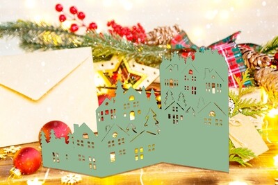 3D SVG Christmas card template for Cricut and Silhouette cutting machines complete with cozy homes and pine trees nestled among mountains.