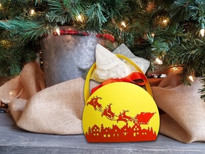 Holiday gift basket of Santa soaring above a Snowy Village made with a 3D SVG template. 