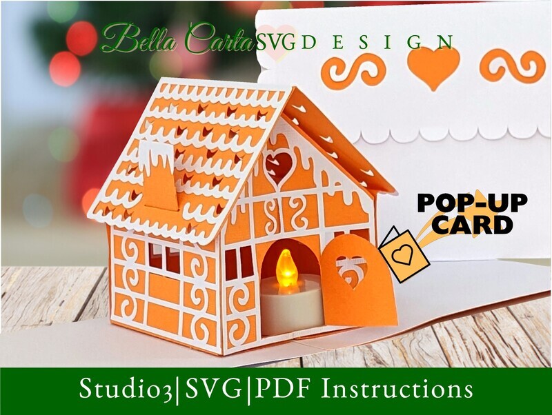 Finished Gingerbread House Pop-up Card made with  a 3D SVG template for Cricut, Silhouette, and other cutting machines decorated with intricate &quot;icing&quot; details and an LED tealight inside the door to make it glow. The front of the card features a cut-out image of a gingerbread house and the message Sweet Wishes. 