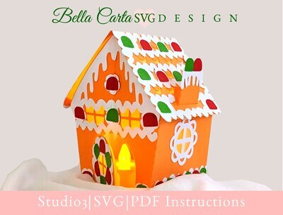 Finished 3D SVG Cricut project of a pop-up Christmas Village house decorated with gumdrop candies and an LED tealight inside the door to make it glow.  This decoration is part of the Christmas Treat Village collection by Bella Carta Design.