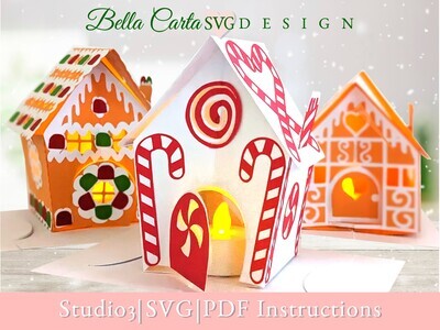 Finished 3D SVG Cricut project of a Christmas Village decorated with treats: gingerbread, candy canes and gumdrops.  Each village house has an LED tealight inside the door to make it glow.The house in the front is the Candy Cane Cottage.