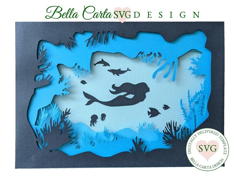 This is an undersea mermaid layered card crafted with a 3D SVG and a Cricut, Silhouette or other cutting machine.  The front of this 5 by 7-inch card can be customized to depict either a little mermaid or a playful humpback whale, along with your choice of other sea life inside a magical sea cave. It includes a themed envelope template featuring a cutout coral decoration. 