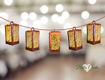Elegant lantern in rose gold metallic paper features an intricate floral-inspired, scrollwork cut-out design.The delicate swirls and leaf motifs of the cut-out pattern are easily made with a Cricut and Bella Carta Design’s 3D SVG file. 