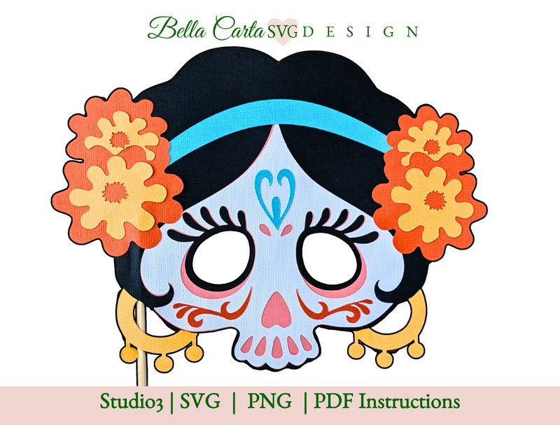 A vibrant Dia de Los Muertos paper mask template depicting La Catrina in a sugar skull style, designed as a Cricut project. The mask features a skull with intricate decorative elements, such as colorful floral accents, a blue heart on the forehead, and golden earrings. The mask is intended for use as a wearable paper mask or for Day of the Dead celebrations.