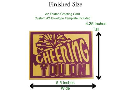3D layered paper card featuring a cheerleader megaphone, pom-poms, and the words 'Cheering You On.' Designed as a layered SVG