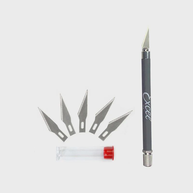 CUSHION GRIP ON KNIFE WITH EXTRA BLADES