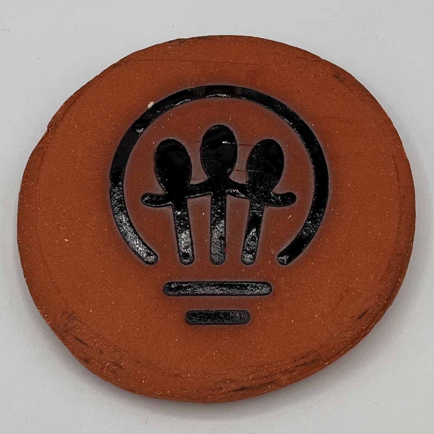 Mark Uczen, Lightbulb Logo ceramic coaster