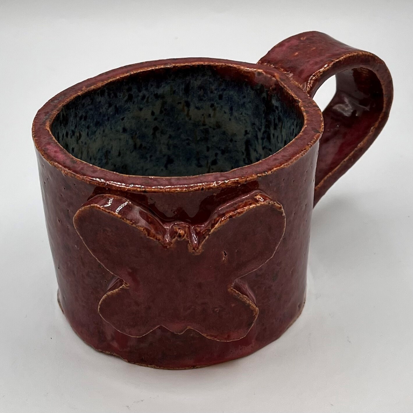 Bobbie Jo Robinson, Red ceramic cup with butterfly