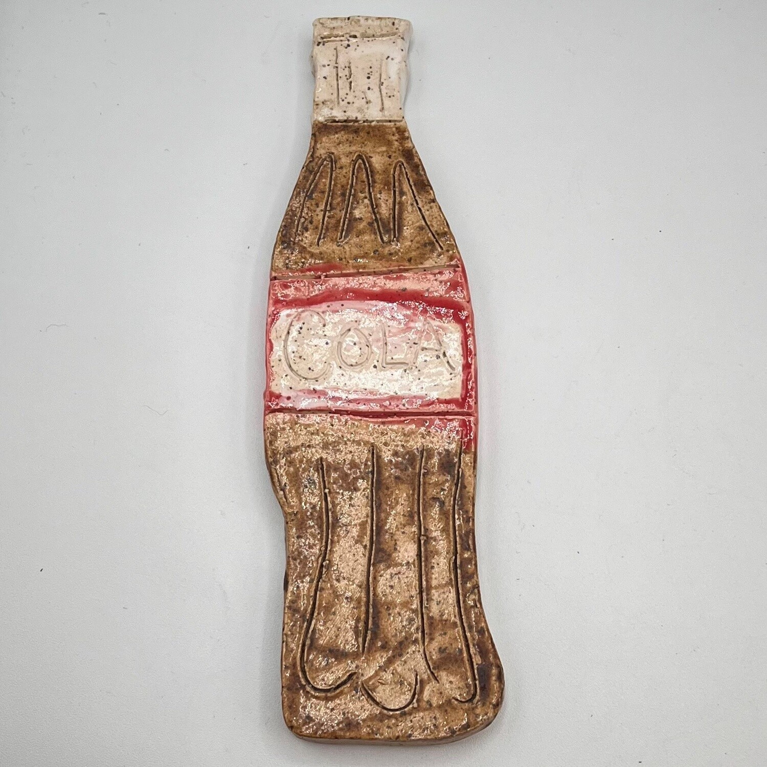 James Egan, Ceramic cola bottle figurine