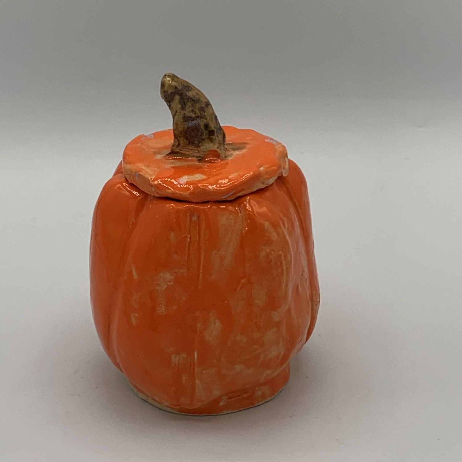 Jody Mann, Vibrant pumpkin ceramic container with lid