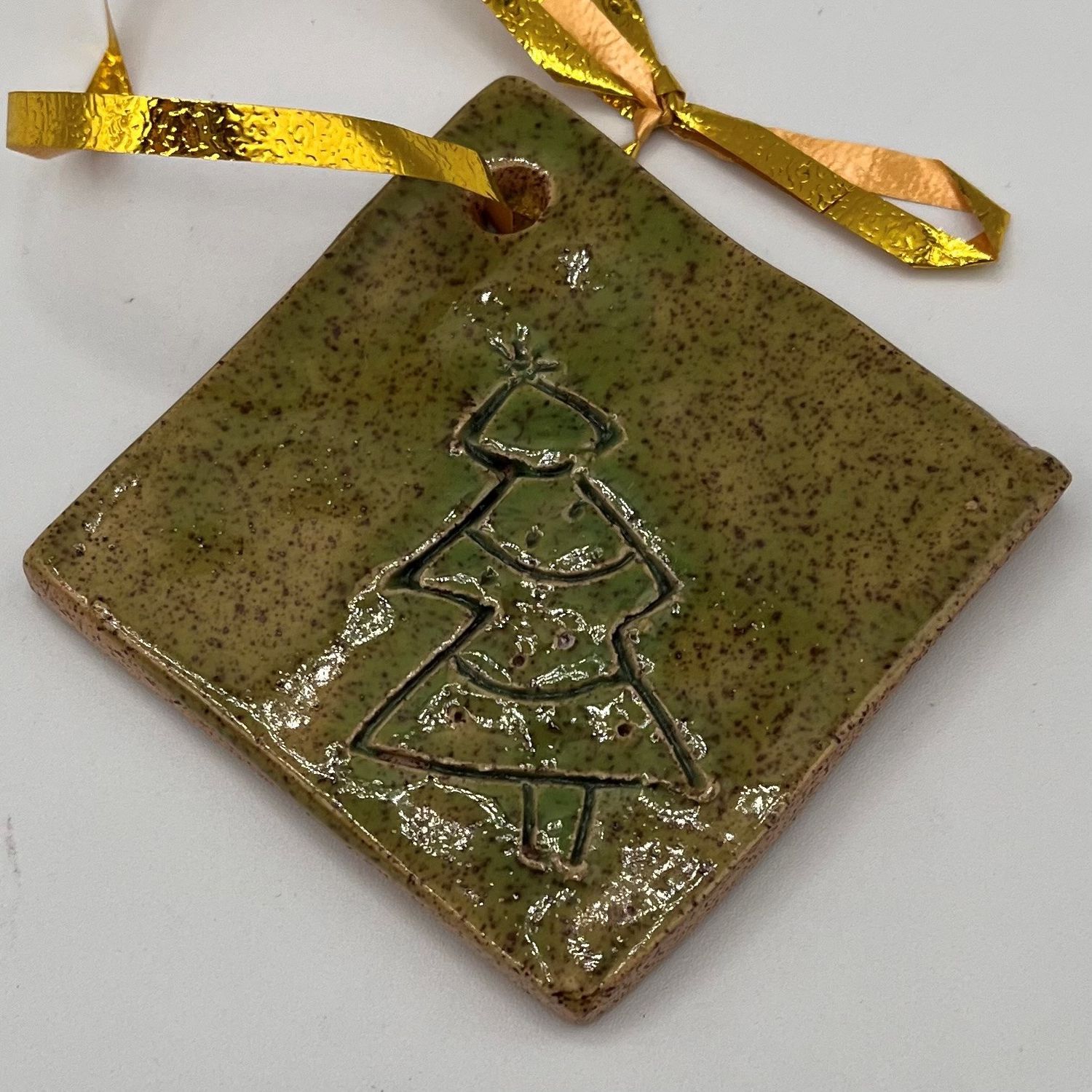 Christina Hanes, Green ceramic ornament with tree design