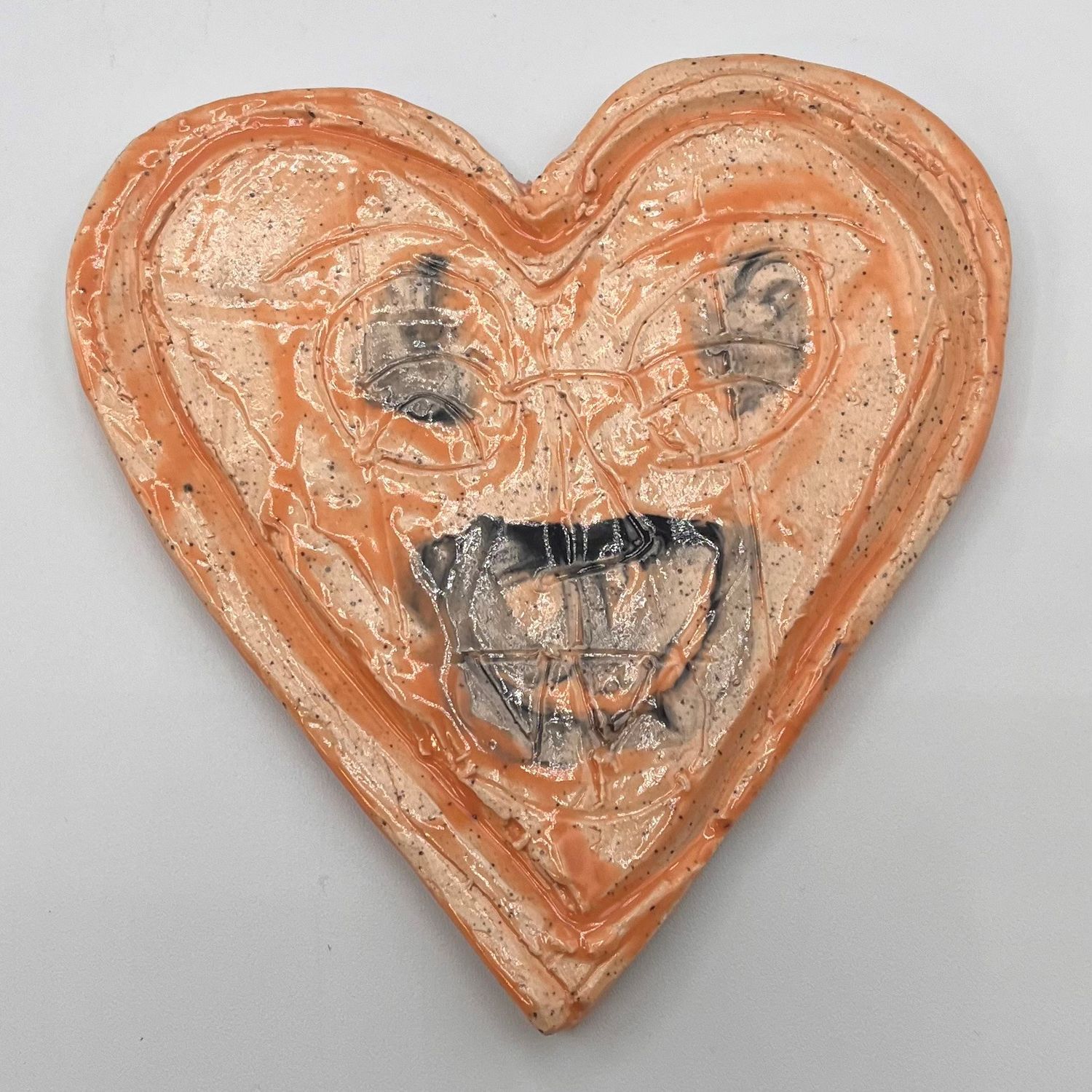 James Egan, Ceramic Heart, Orange with Black Face
