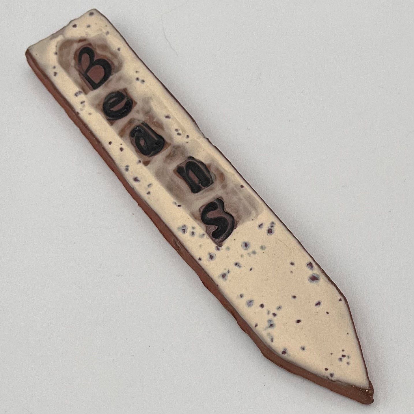 Studio, Ceramic Plant Stake, Beans on Speckled White Background