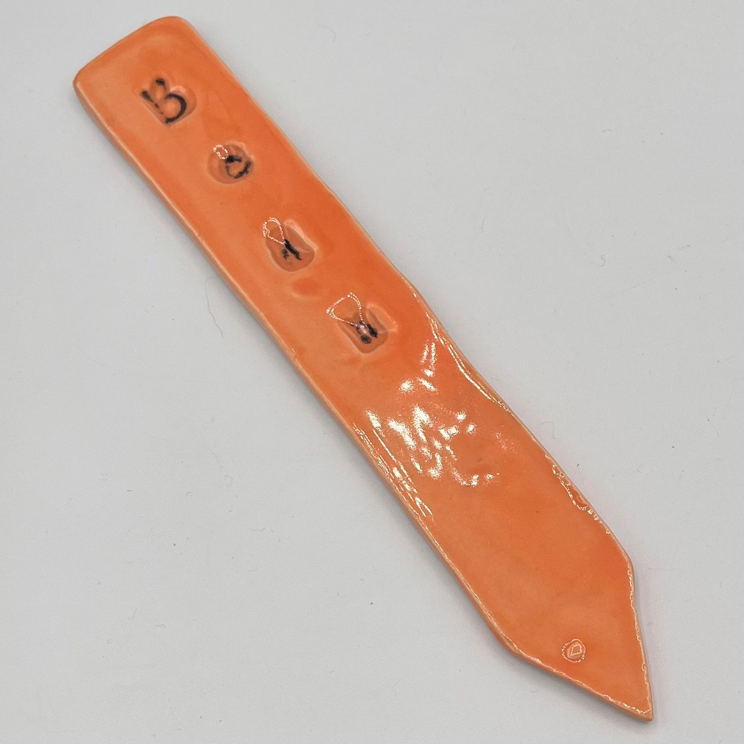Bobbie Jo Robinson, Ceramic Plant Stake, Bean on Orange Background