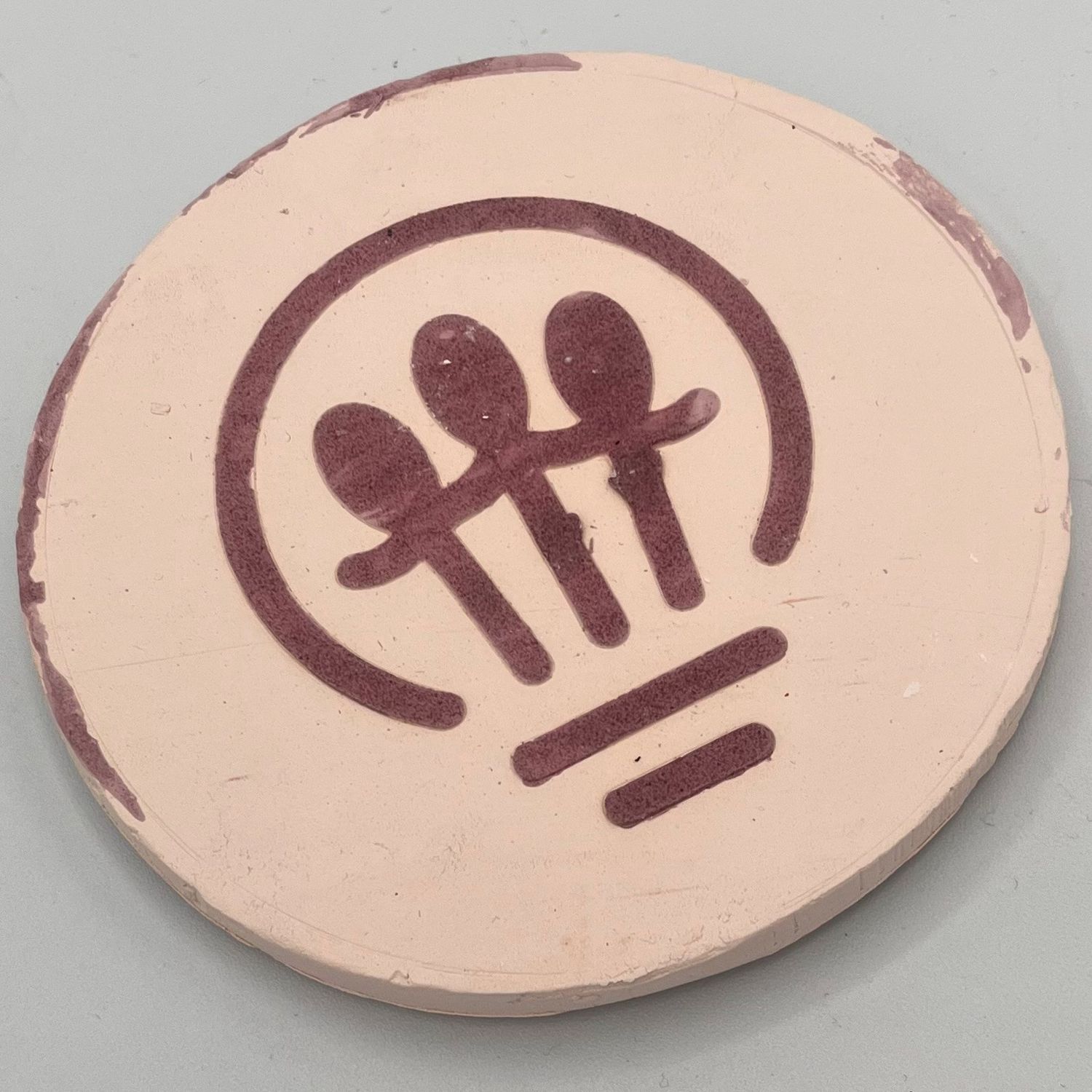 Mark Uczen, Ceramic Coaster, Purple Lightbulb Logo
