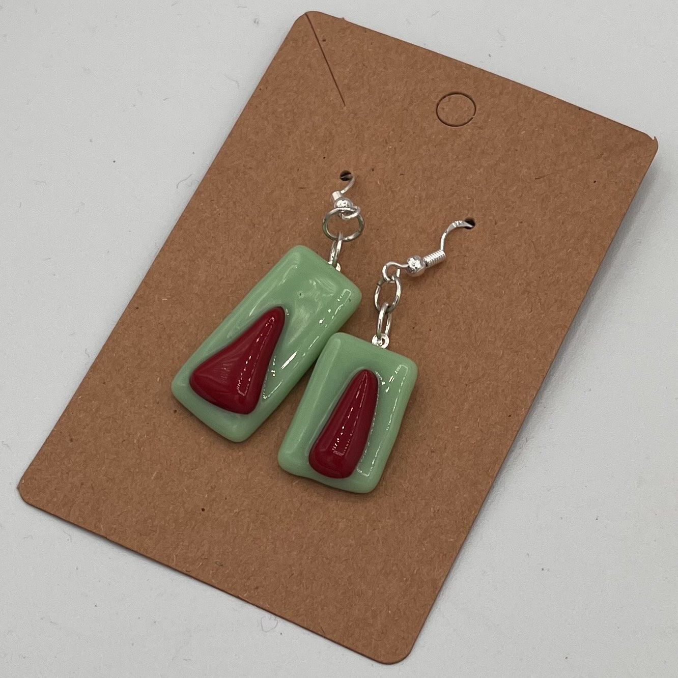 Alphonso Rowe, Fused Glass Earrings, Red Triangles on Green Background