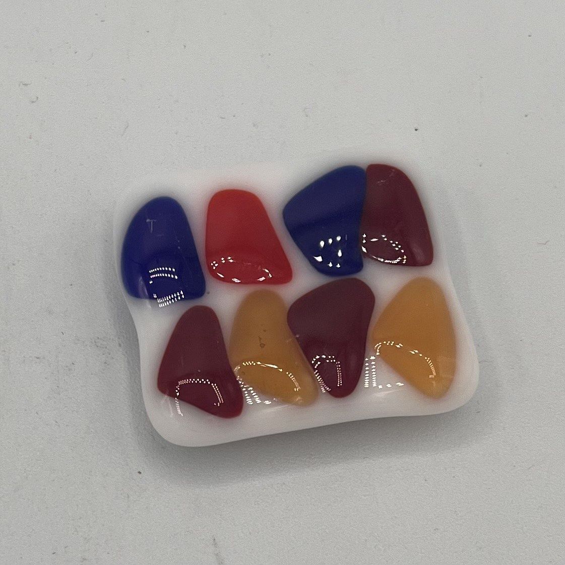 Meredith Bokeno, Fused Glass Magnet, Red, Orange, Yellow and Blue Shapes
