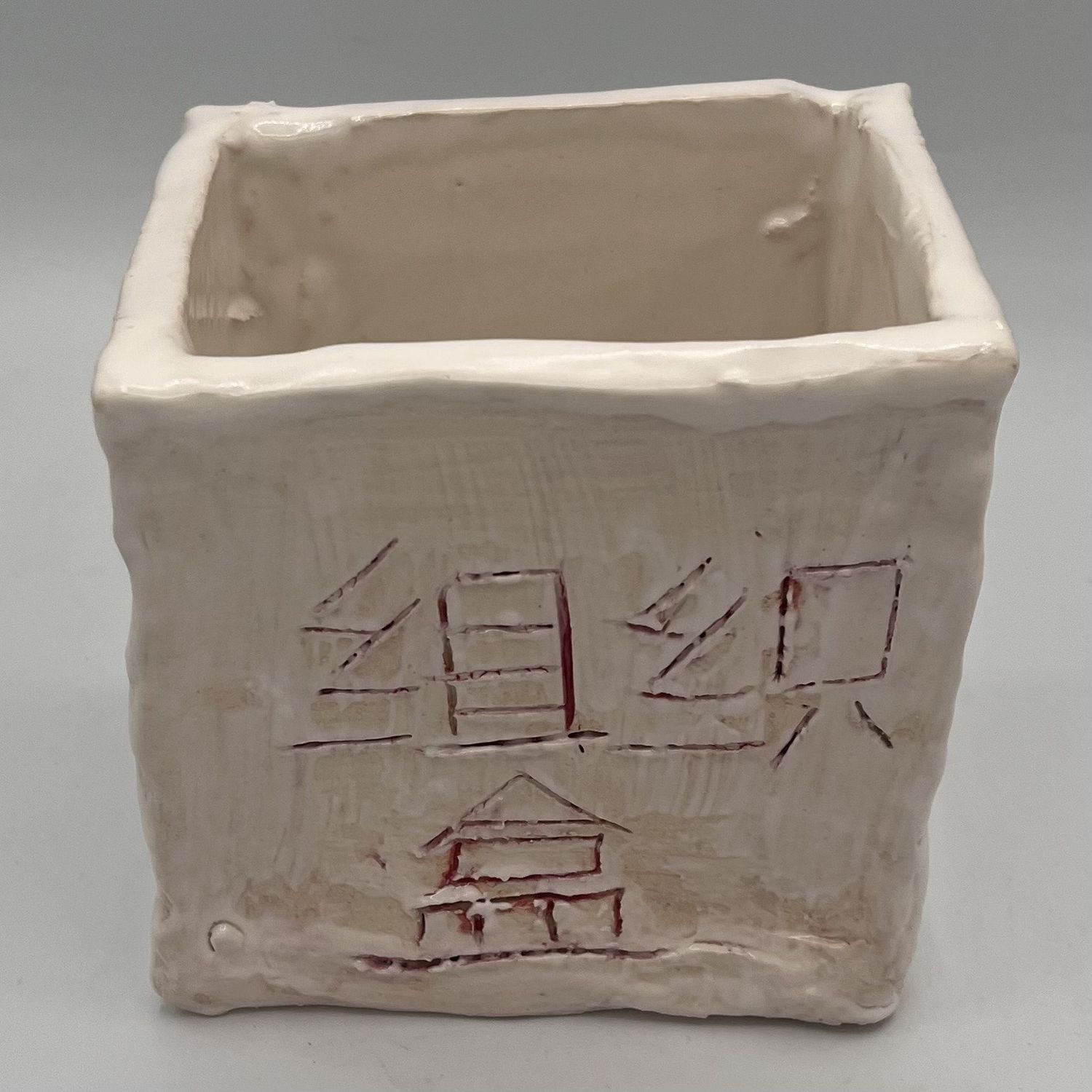 Rebecca Reed, Ceramic Container, Red Lettering on White