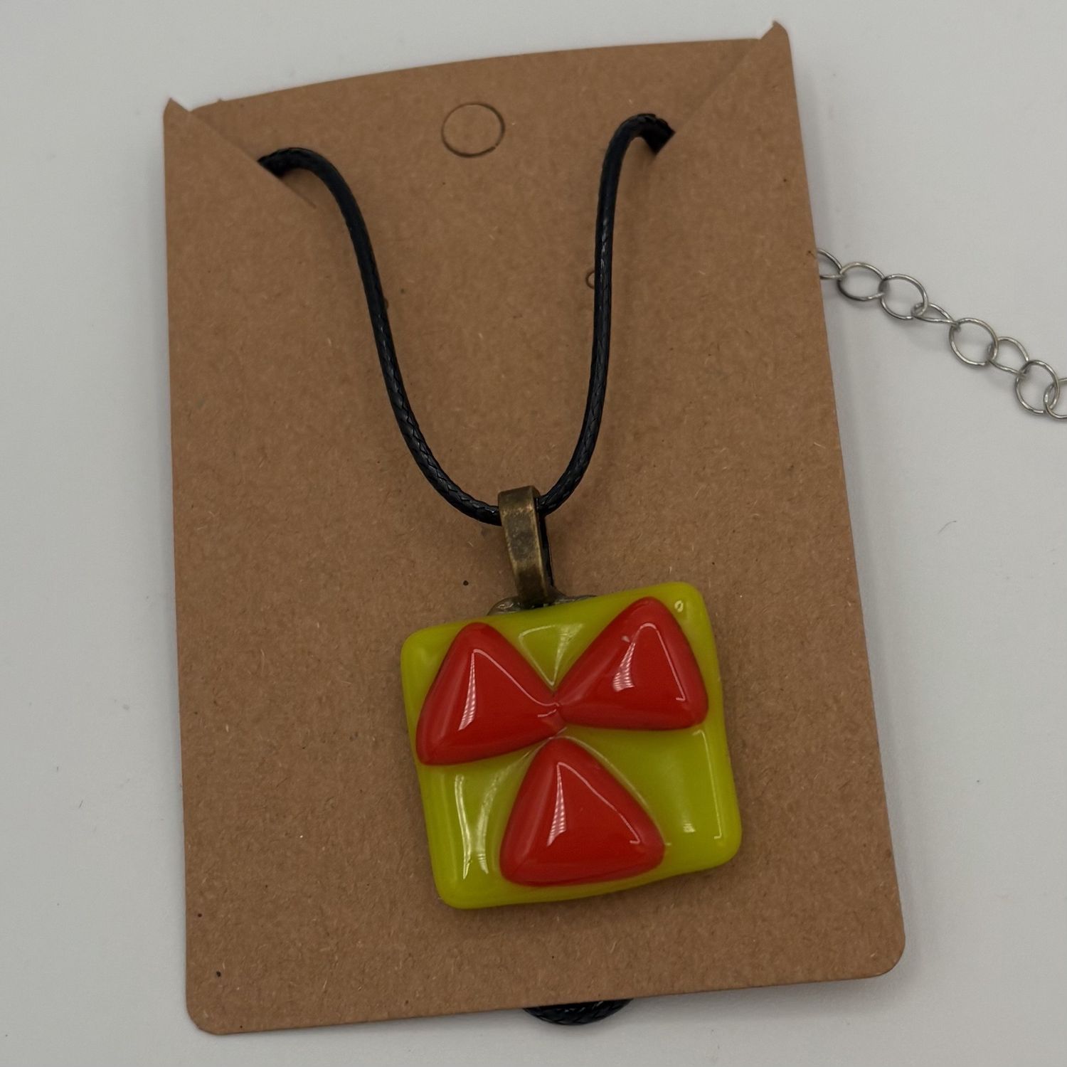 Alphonso Rowe, Fused Glass Pendant, Orange Triangles on Green