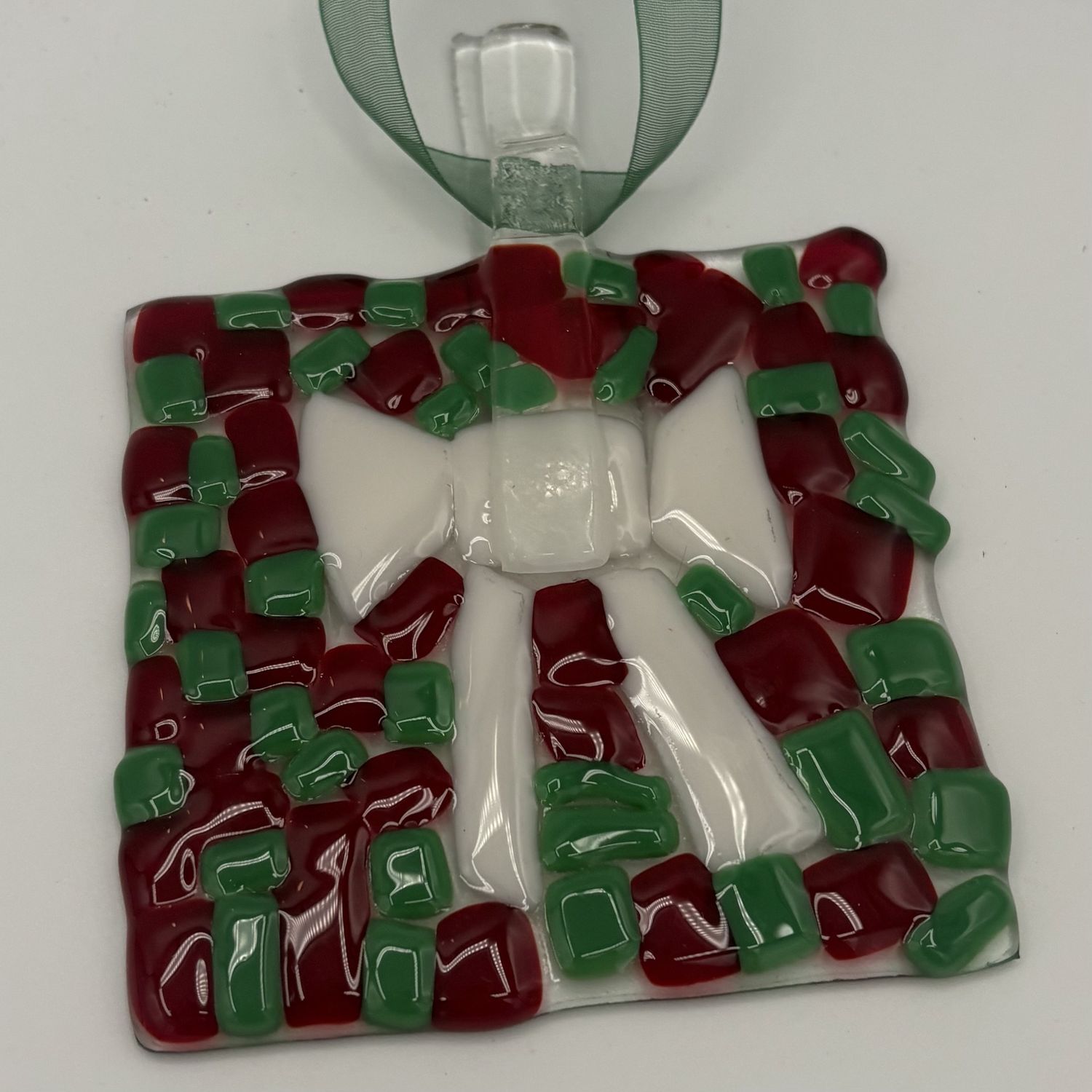 Adam Gibbemeyer, Fused Glass Ornament, White Bow on Red and Green Background