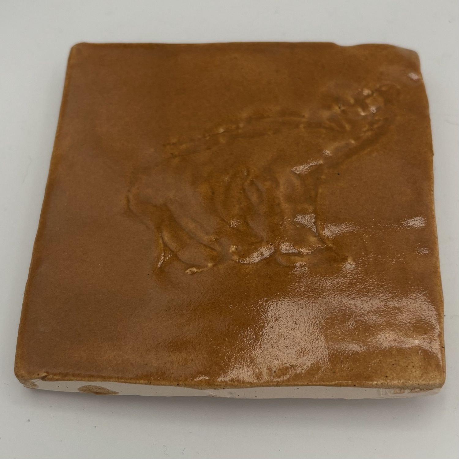 Breanna Allmandinger, Ceramic Coaster, Animal on Yellowish-Brown