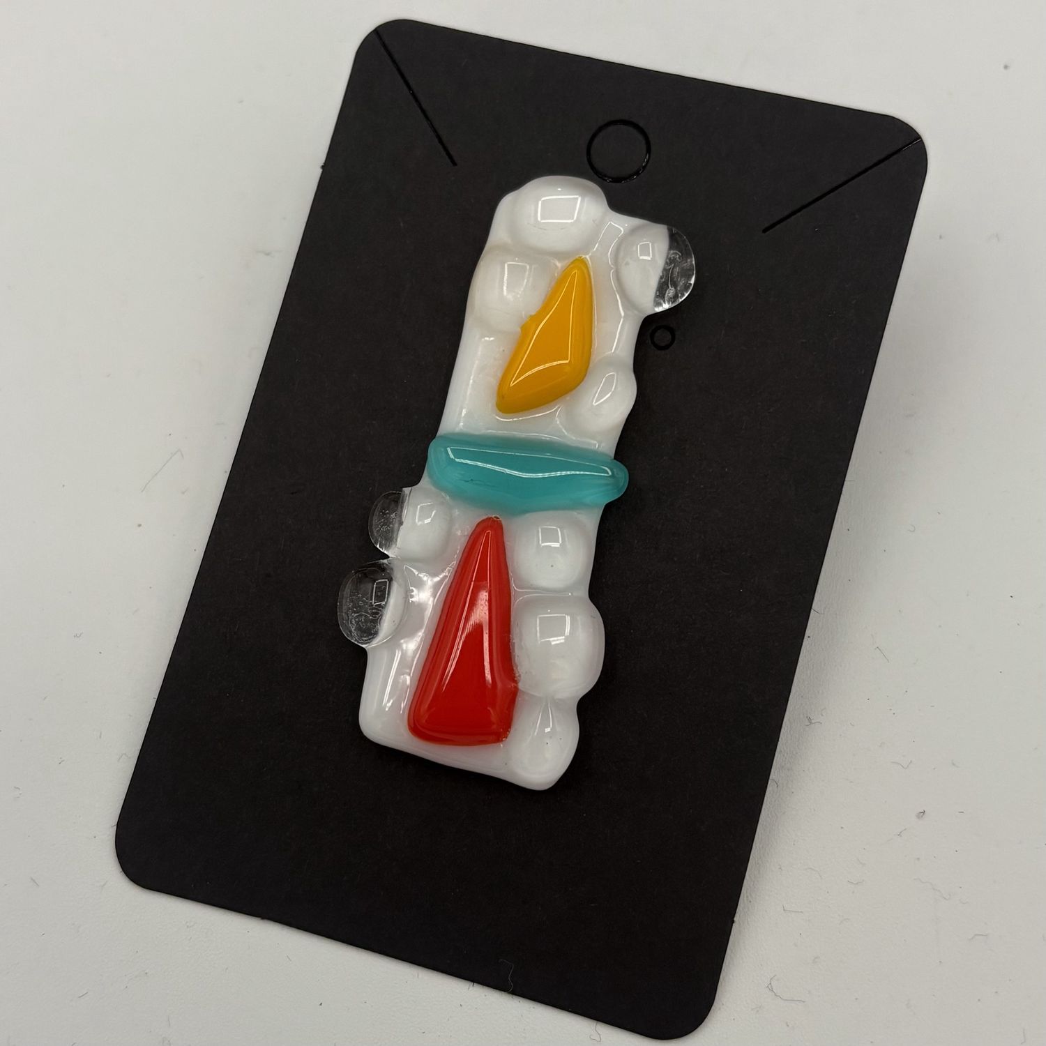 Erica Hasler, Fused Glass Pin, Orange, Yellow and Blue Shapes