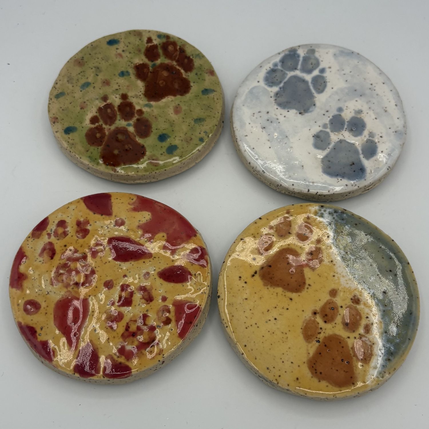 Sarah Alward, Ceramic Coaster Set, Colorful Pawprints